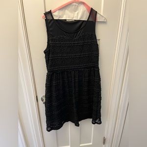 Black dress with sheer shoulders and cute ruffle texture.